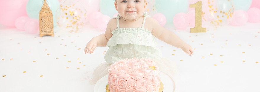 smiling first birthday portrait by Looking Up Photography